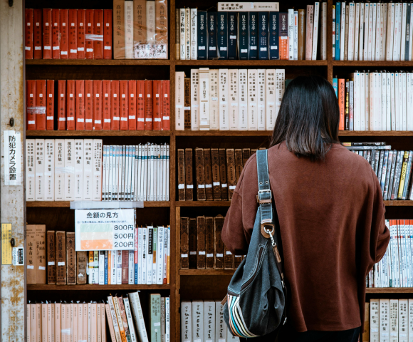 Person looking at bookshelf